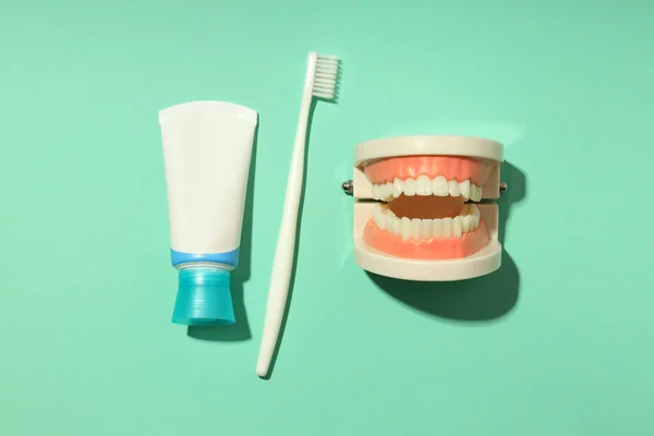 Concept of dental care on mint background