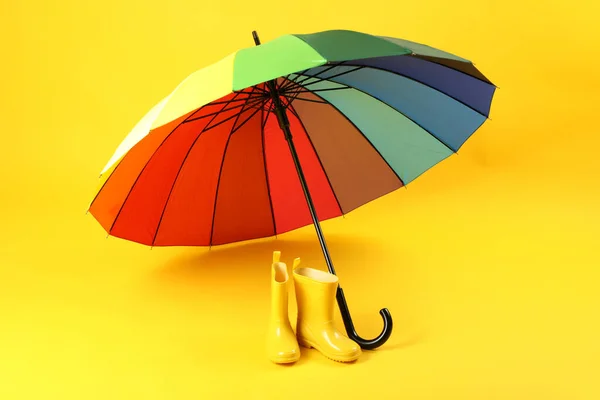 Umbrella Rubber Boots Yellow Background — стоковое фото