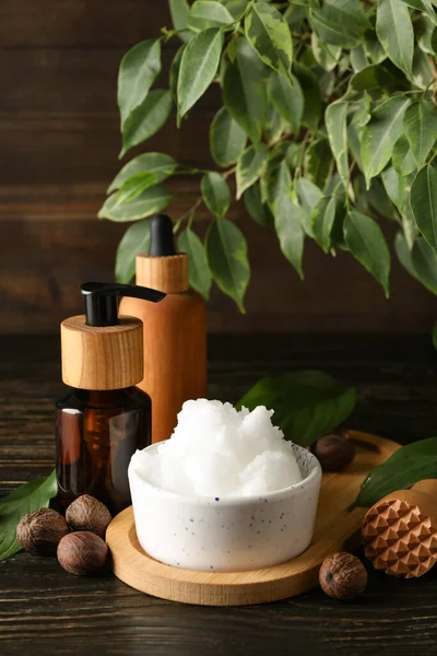Concept of skin care cosmetics on wooden table, Shea butter