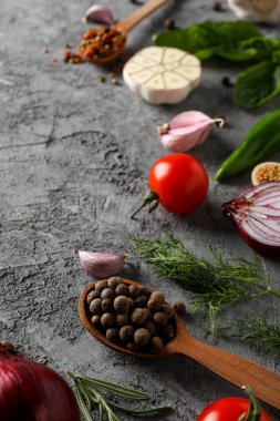Different ingredients for cooking on gray textured background