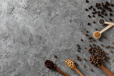 Different ingredients for cooking on gray textured background
