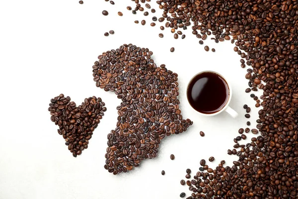 African continent made of coffee beans on white textured background
