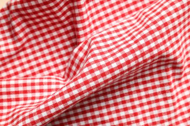Red and white checkered tablecloth, close up