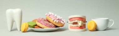 Concept of food bad for teeth on light gray background