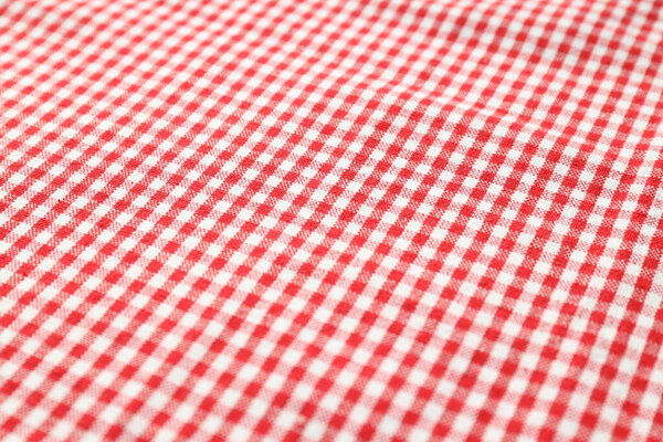 Red and white checkered tablecloth on whole background