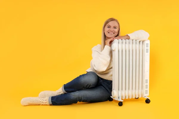 Heating Season Woman Heater Yellow Background — 图库照片