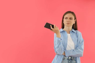 Concept of people, young woman on pink background