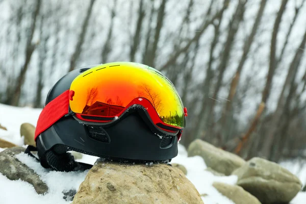 Ski helmet with goggles outdoor, space for text