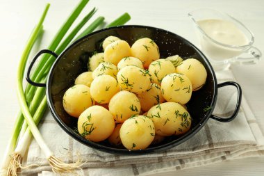 Concept of tasty food with boiled young potatoes, close up
