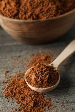 Concept of spices and condiments, nutmeg powder, close up