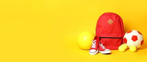Balls Backpack Sneakers Yellow Background — Foto de Stock