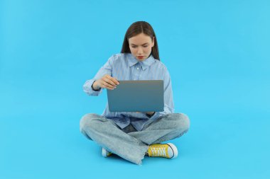 Concept of people, young woman on blue background