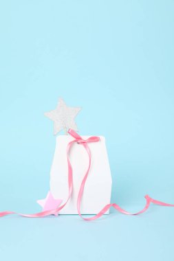 Concept of gift, gift bag on blue background