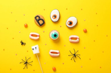 Concept of Halloween sweets, funny sweets, top view