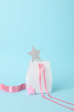 Concept of gift, gift bag on blue background