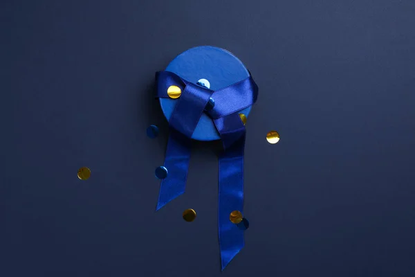 Concept of gift, gift box on dark blue background