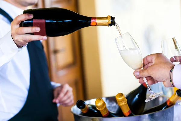 Waiter pouring champagne — Stock Photo, Image
