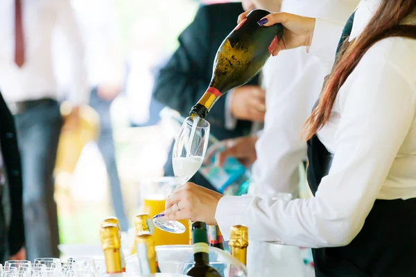 Waiter pouring champagne — Stock Photo, Image