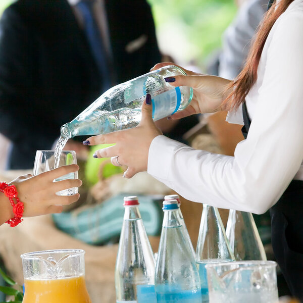 Waiter pouring champagne