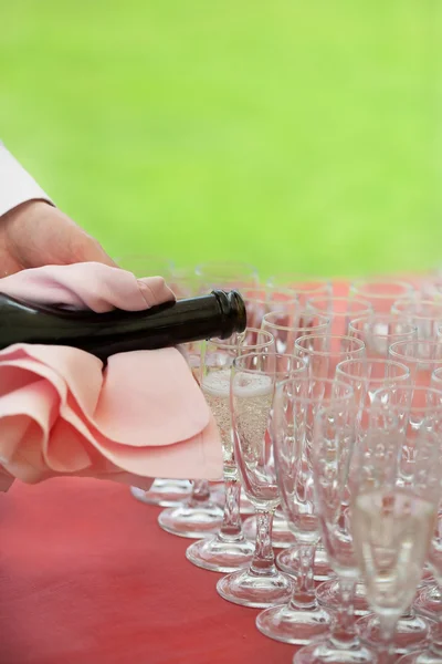 Waiter pouring champagne — Stock Photo, Image