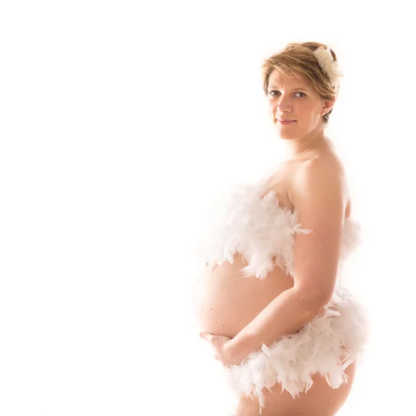 白い背景の上の妊娠中の腹 — ストック写真