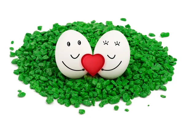 Two eggs on green stones. — Stock Photo, Image