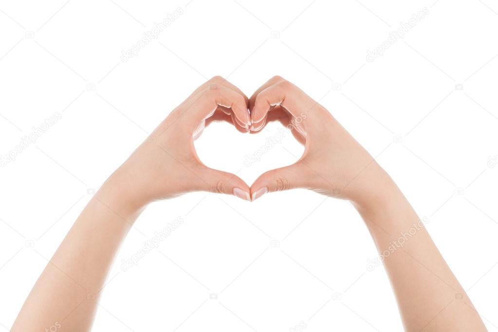 Heart shape made of two woman's hands.