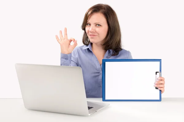 Businesswoman is sitting in front of a laptop — Stock Photo, Image