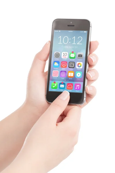 Female hands holding black smart phone with colorful application — Stock Photo, Image