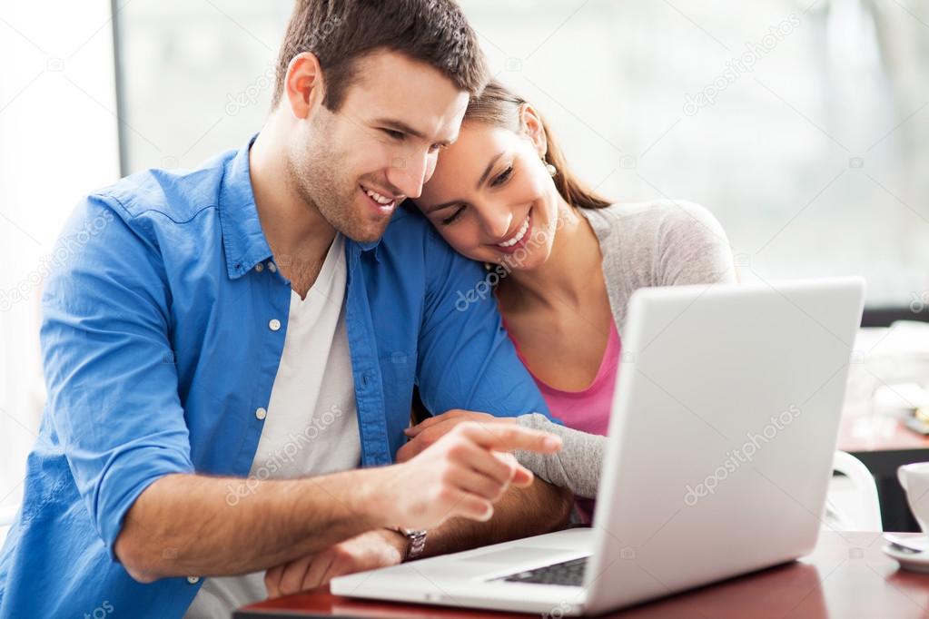 Young couple using laptop