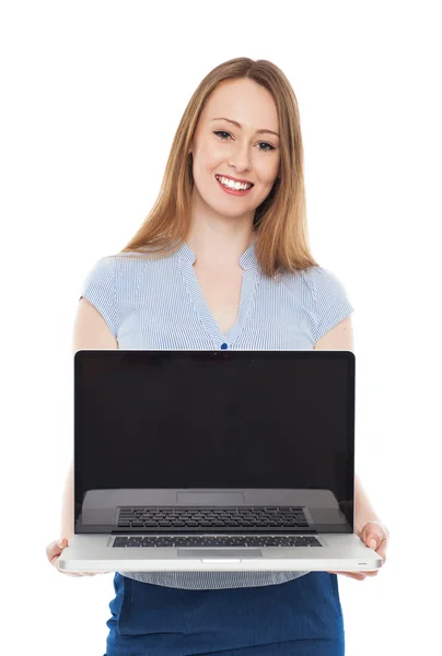 Young businesswoman holding laptop — Stock Photo, Image