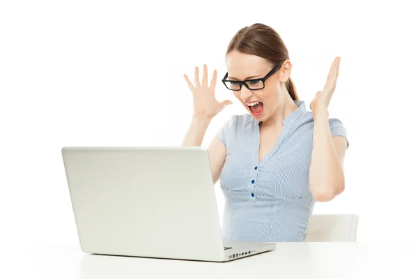 Shocked businesswoman looking at laptop — Stock Photo, Image