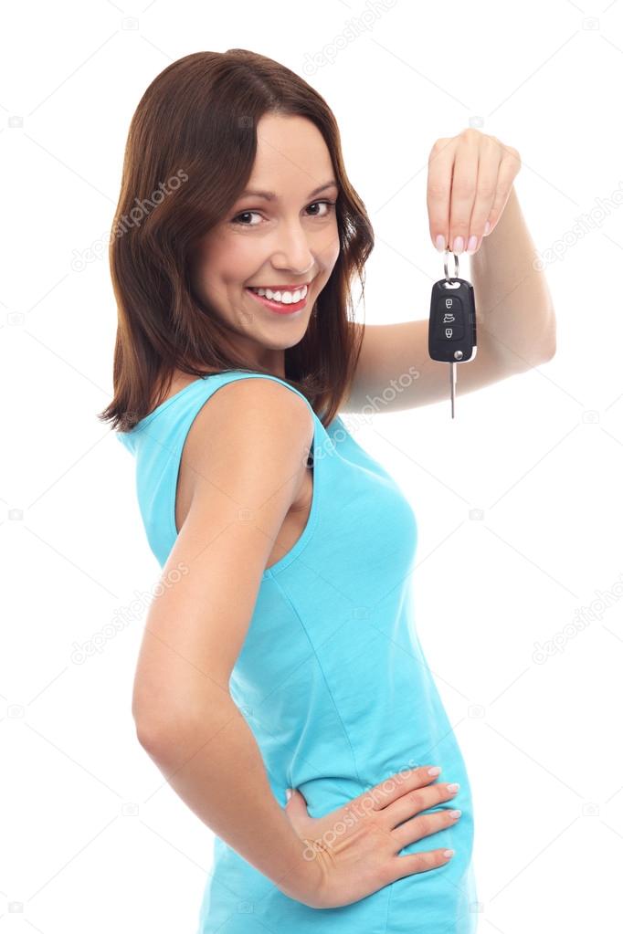 Young woman showing car key