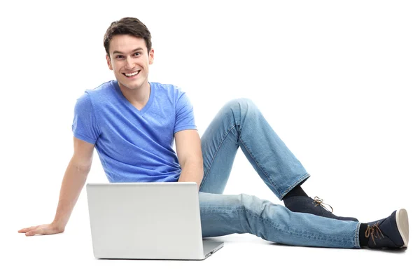 Junger Mann mit Laptop — Stockfoto