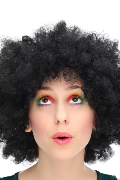 Excited woman wearing afro wig Stock Picture