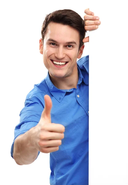 Man with blank poster showing thumbs up Stock Photo