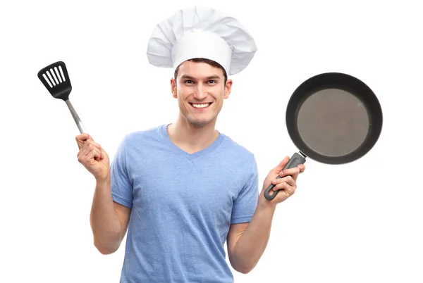 Šéfkuchař drží kuchyňské náčiní — Stock fotografie