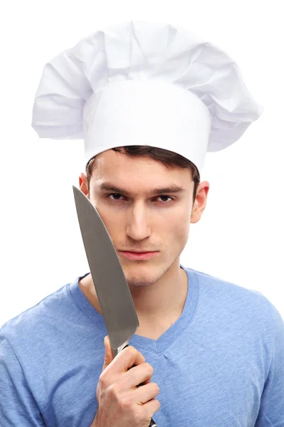 Człowiek z kapelusz kucharz i noże — Zdjęcie stockowe