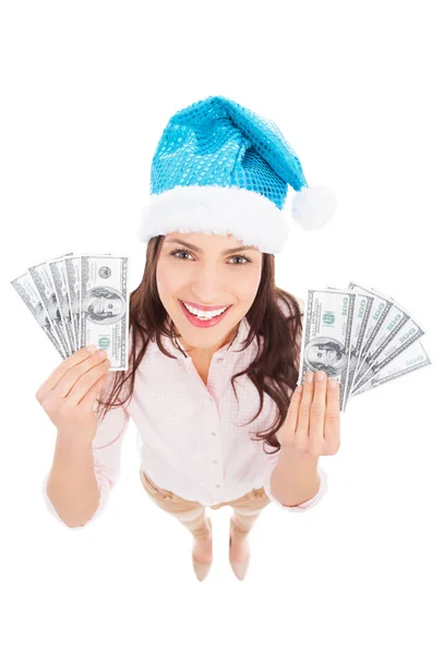 Mujer en Santa hat sosteniendo dinero —  Fotos de Stock