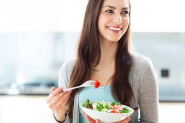 Woman eating salad clipart