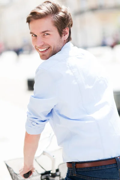 Young man on bike — Stock Photo, Image