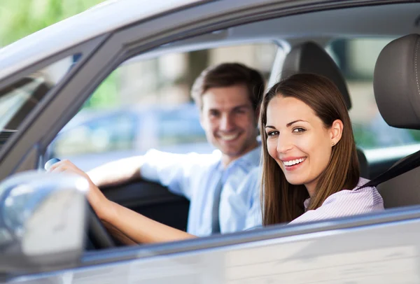 Young couple sitting in car Royalty Free Stock Images