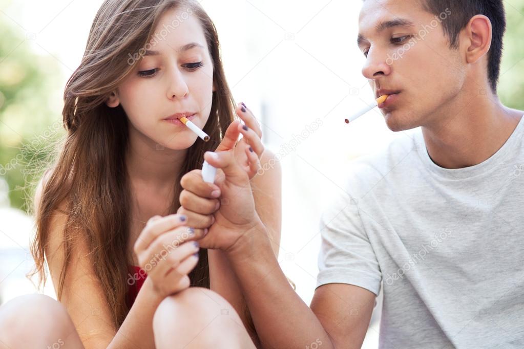 Teenage couple smoking