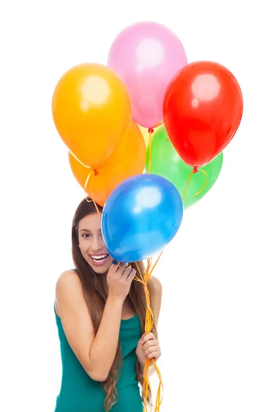 Mujer sosteniendo un montón de globos — Foto de Stock