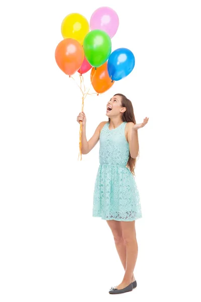 Woman holding a bunch of balloons — Stock Photo, Image