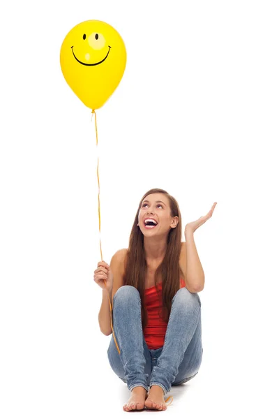 Giovane ragazza felice con palloncino giallo Immagini Stock Royalty Free
