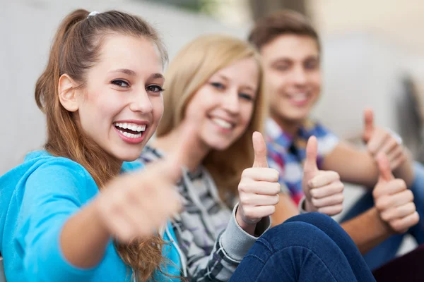 Young showing thumbs up — Stock Photo, Image