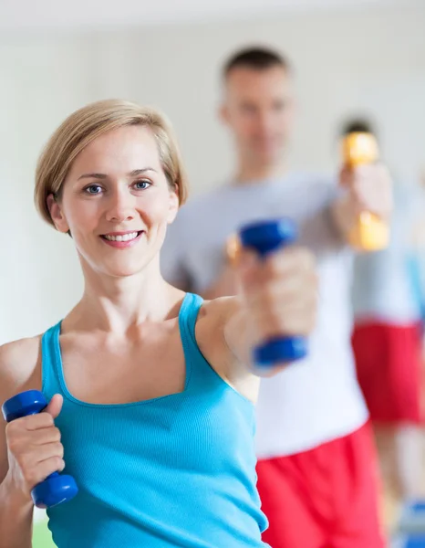 Couple working out with dumbbells — Stock Photo, Image