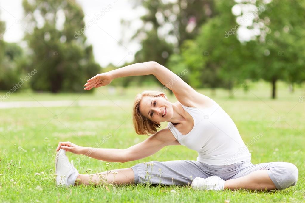 Woman stretching in a park