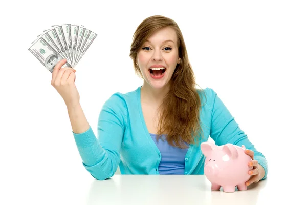 Vrouw met piggy bank en dollarbiljetten — Stockfoto